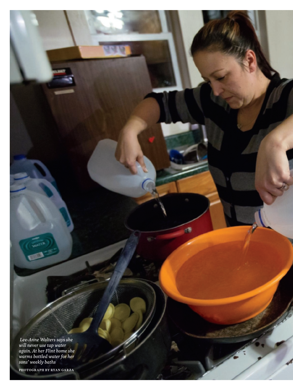 Lee-Anne Walters Says She Will Never Use Tap Water Again. at Her Flint Home She Warms Bottled Water for Her Sons’ Weekly Baths