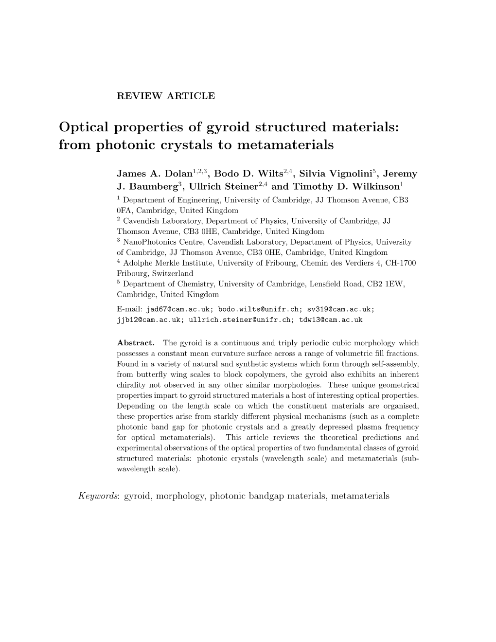 Optical Properties of Gyroid Structured Materials: from Photonic Crystals to Metamaterials