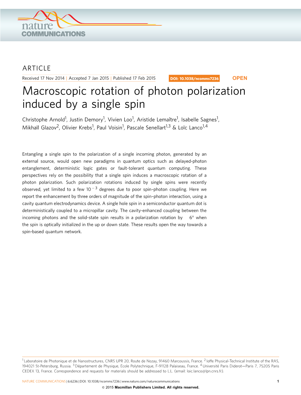 Macroscopic Rotation of Photon Polarization Induced by a Single Spin