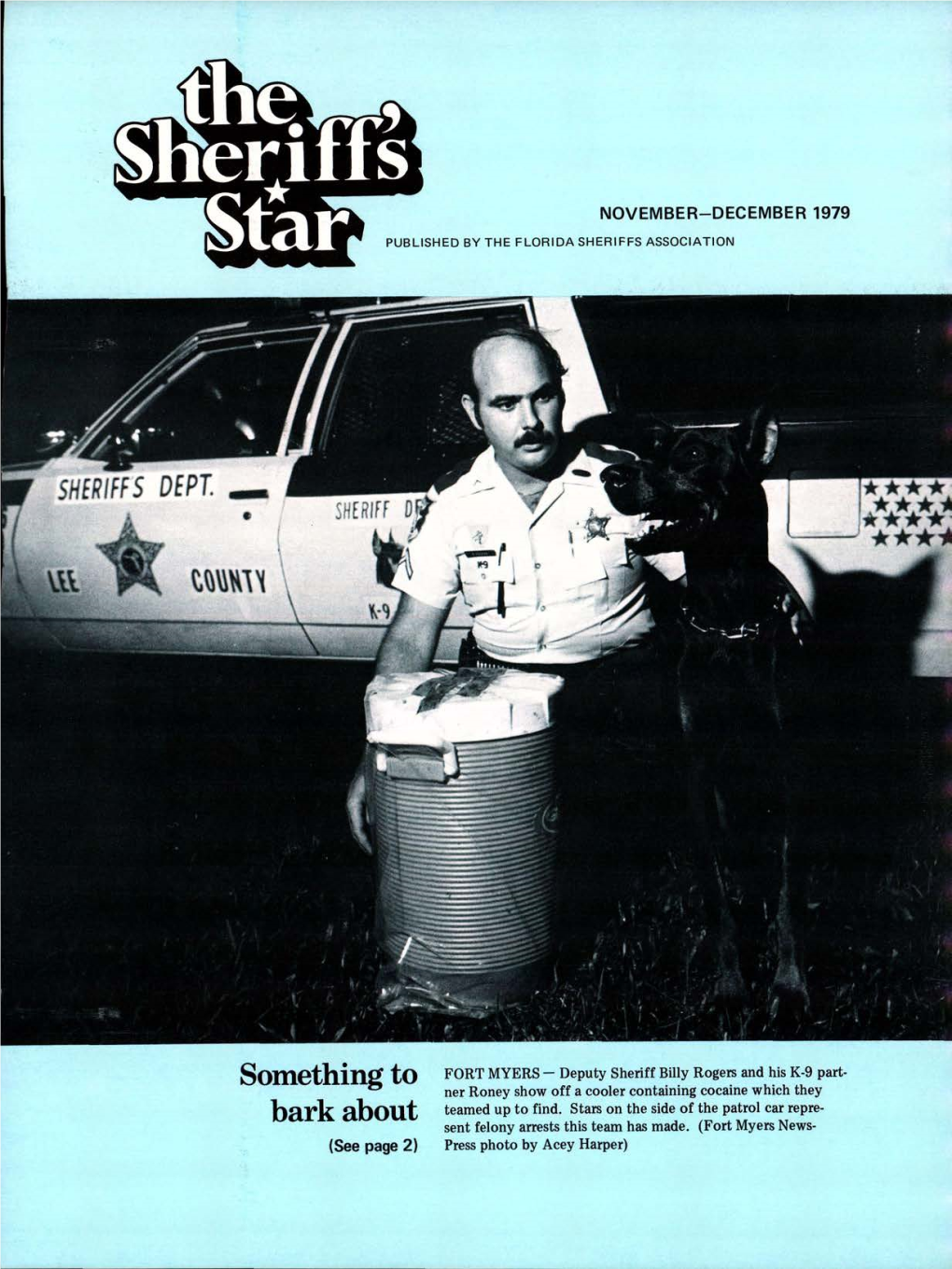 Somethmg T0 FORT MYERS- Deputy Sheriff Pity Rogers and Hi K-9 Ner Roney Show Off a Cooler Containing Cocaine Which They Bggg Qb0qt Teamed up to Find