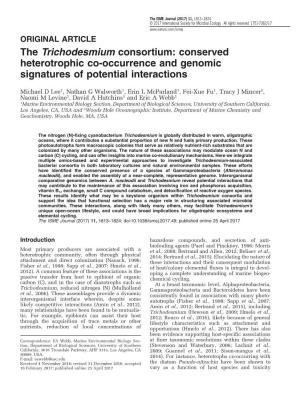 The Trichodesmium Consortium: Conserved Heterotrophic Co-Occurrence and Genomic Signatures of Potential Interactions