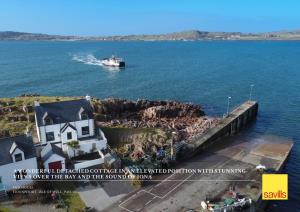 A Wonderful Detached Cottage in an Elevated Position with Stunning Views Over the Bay and the Sound of Iona