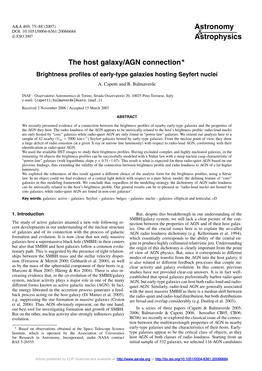 Brightness Profiles of Early-Type Galaxies Hosting Seyfert Nuclei