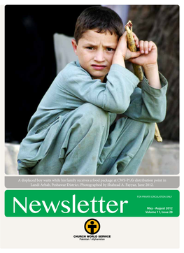 A Displaced Boy Waits While His Family Receives a Food Package at CWS-P/A’S Distribution Point in Landi Arbab, Peshawar District