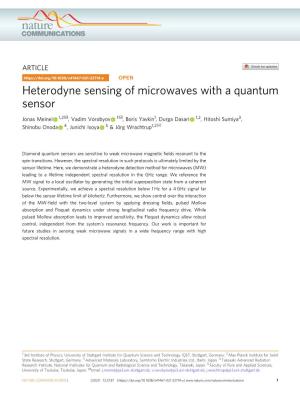 Heterodyne Sensing of Microwaves with a Quantum Sensor