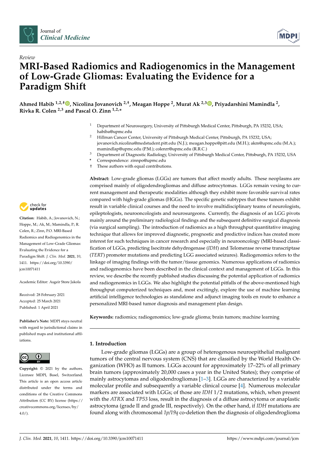 MRI-Based Radiomics and Radiogenomics in the Management of Low-Grade Gliomas: Evaluating the Evidence for a Paradigm Shift