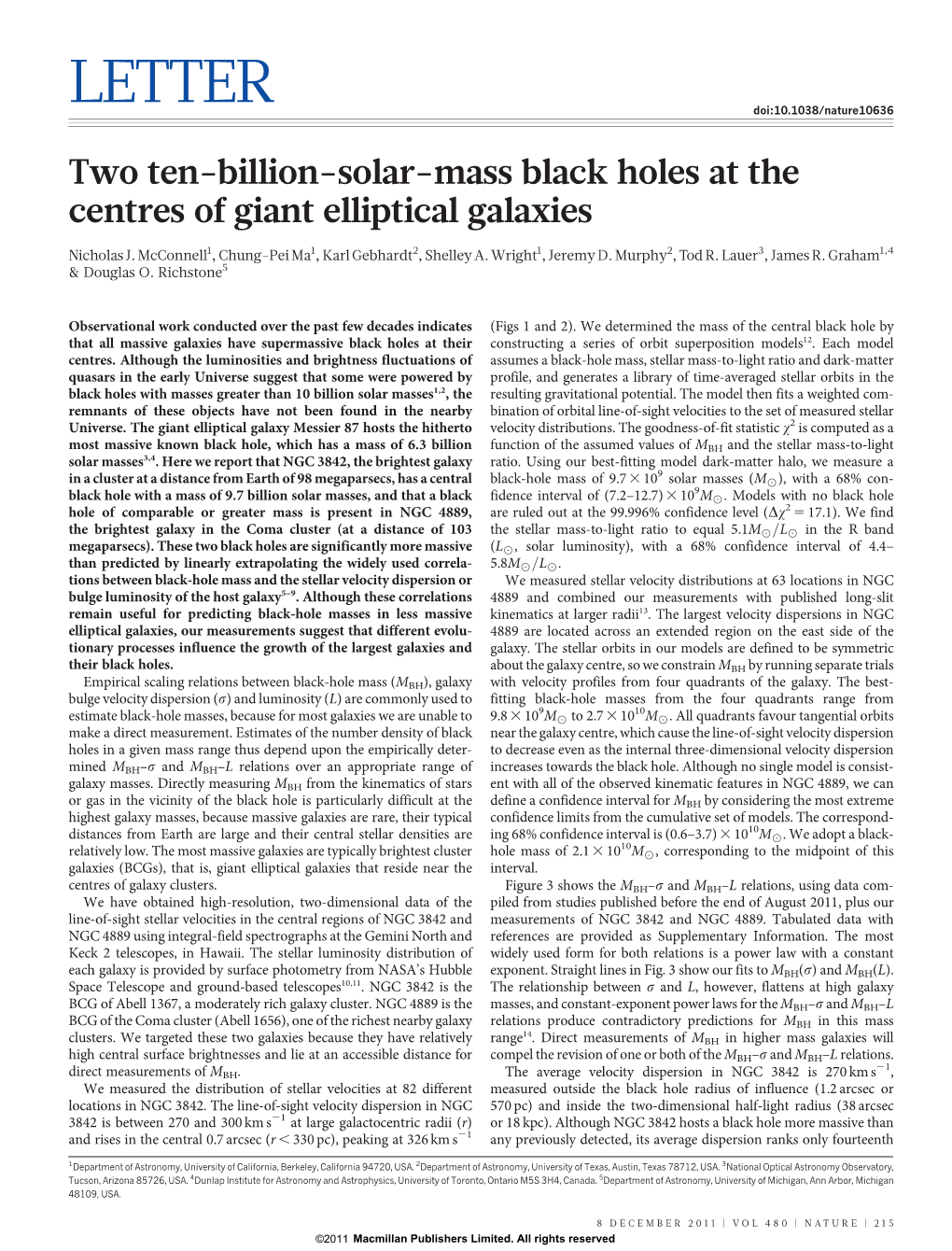 Two Ten-Billion-Solar-Mass Black Holes at the Centres of Giant Elliptical Galaxies