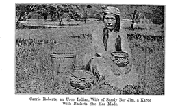 Carrie Roberts, an Uroc Indian, Wife of Sandy Bar with Baskets She Has