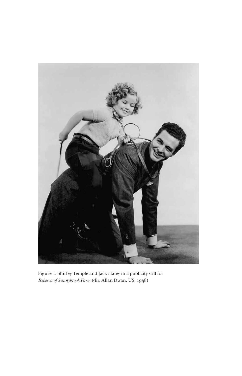 Figure . Shirley Temple and Jack Haley in a Publicity Still for Rebecca of Sunnybrook Farm (Dir