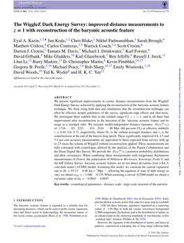 The Wigglez Dark Energy Survey: Improved Distance Measurements to Z = 1 with Reconstruction of the Baryonic Acoustic Feature