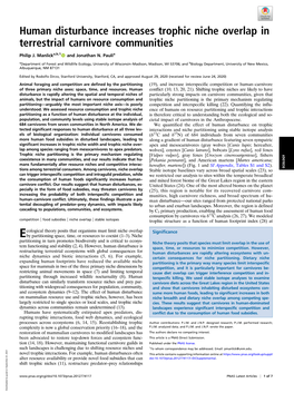 Human Disturbance Increases Trophic Niche Overlap in Terrestrial Carnivore Communities