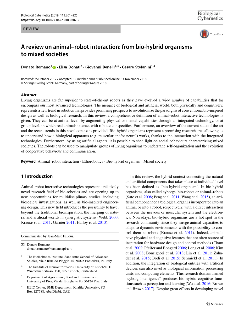 A Review on Animal–Robot Interaction: from Bio-Hybrid Organisms to Mixed Societies