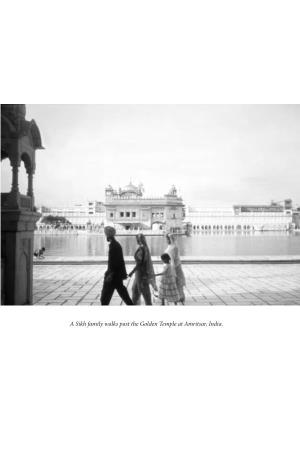 A Sikh Family Walks Past the Golden Temple at Amritsar, India. Chapter 5 Sikhism