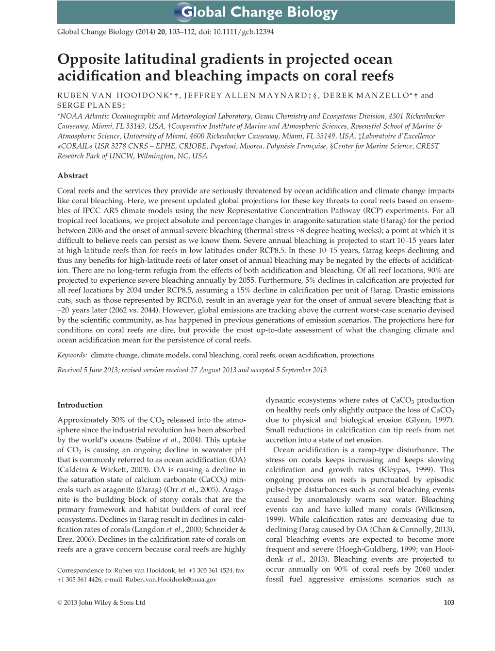 Opposite Latitudinal Gradients in Projected Ocean Acidification and Bleaching Impacts on Coral Reefs