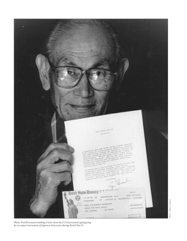 Fred Korematsu Holding a Letter from the US Government Apologizing For