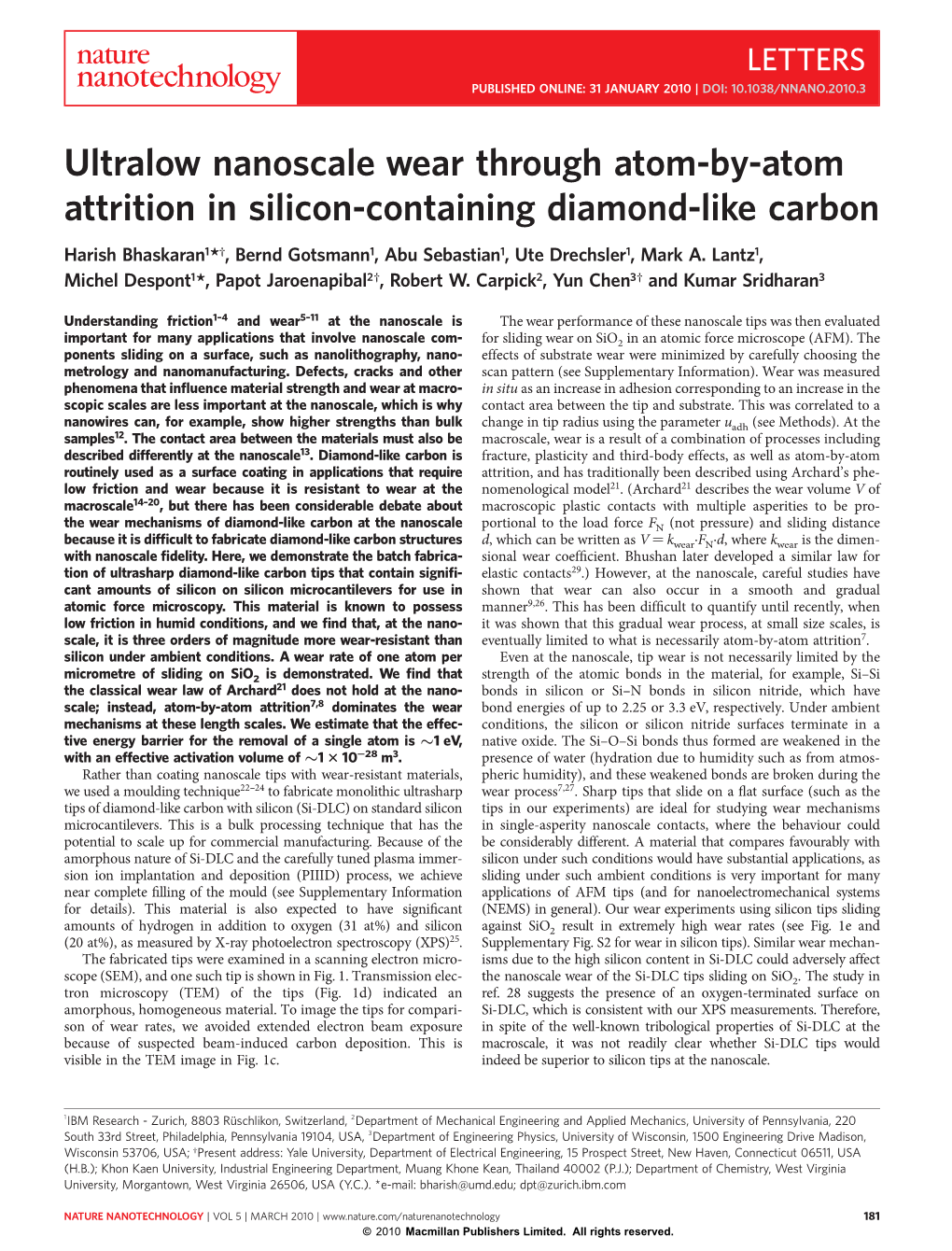 Ultralow Nanoscale Wear Through Atom-By-Atom Attrition in Silicon-Containing Diamond-Like Carbon