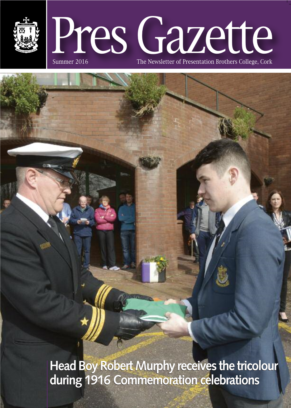 Head Boy Robert Murphy Receives the Tricolour During 1916 Commemoration Celebrations Report by Principal Ken Whyte