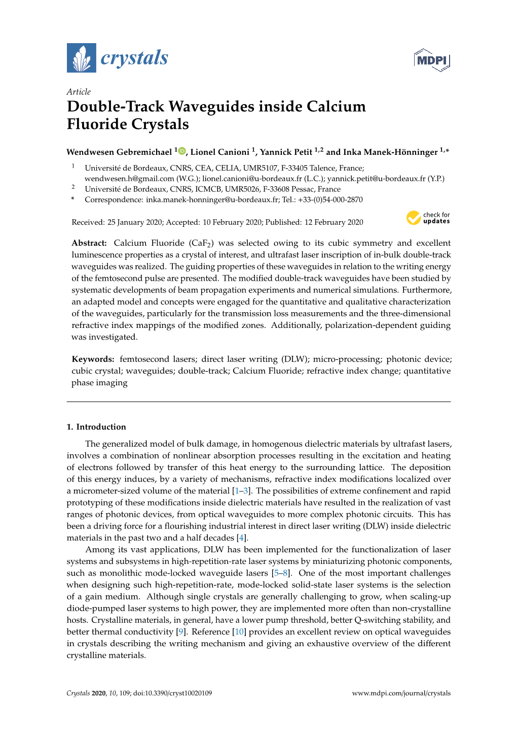 Double-Track Waveguides Inside Calcium Fluoride Crystals