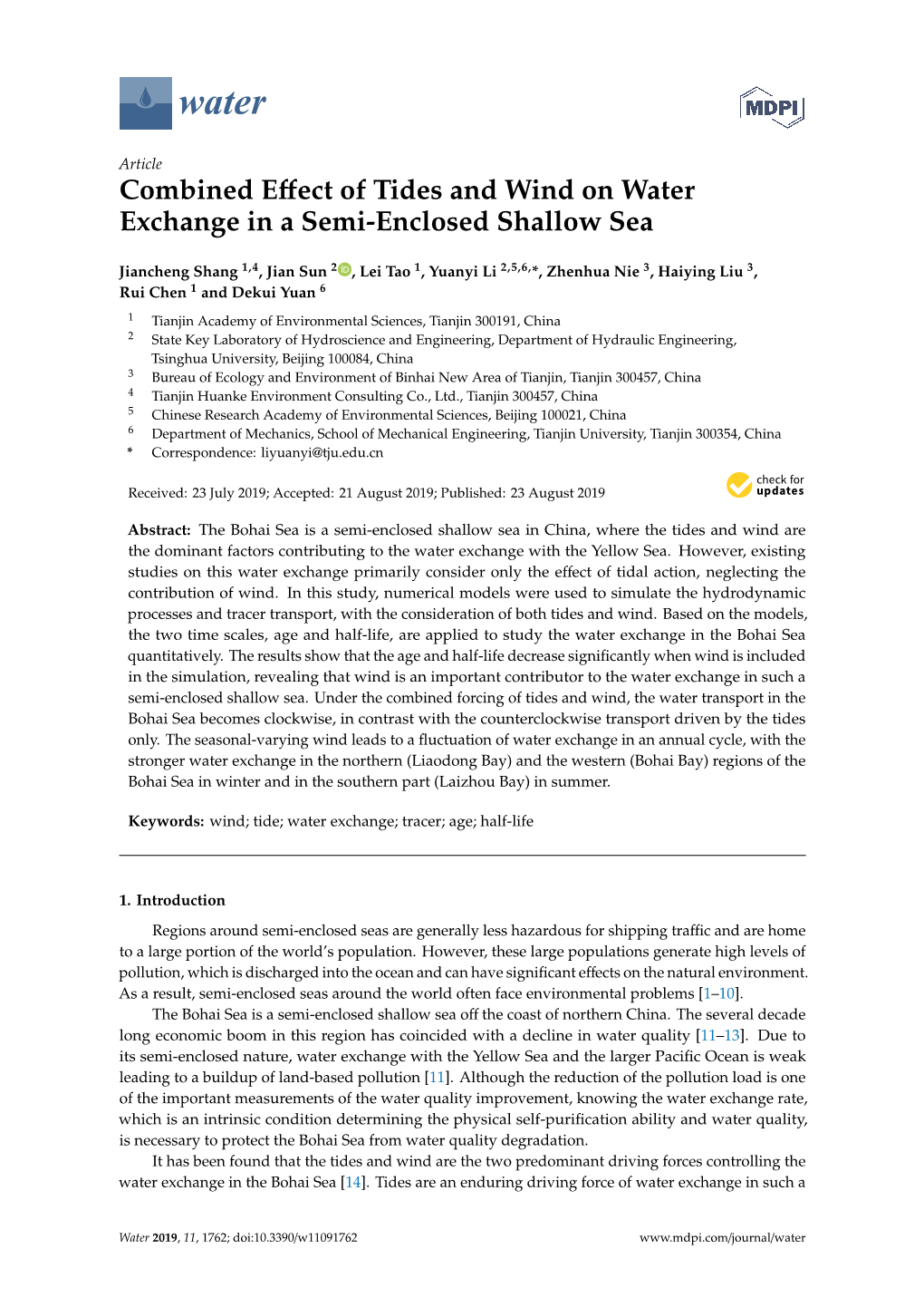 Combined Effect of Tides and Wind on Water Exchange in a Semi