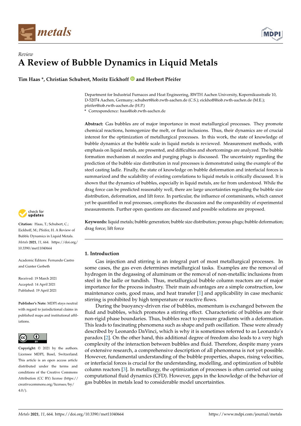 A Review of Bubble Dynamics in Liquid Metals