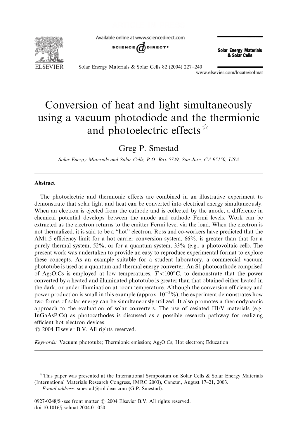 Conversion of Heat and Light Simultaneously Using a Vacuum Photodiode and the Thermionic and Photoelectric Effects$