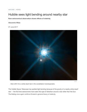 Hubble Sees Light Bending Around Nearby Star : Nature News