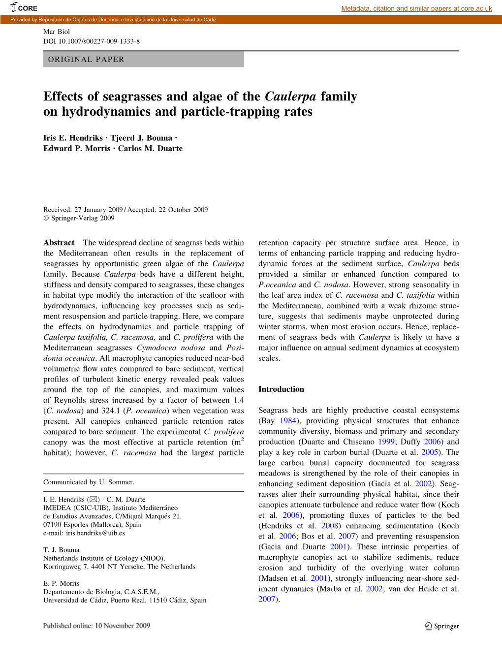 Effects of Seagrasses and Algae of the Caulerpa Family on Hydrodynamics and Particle-Trapping Rates