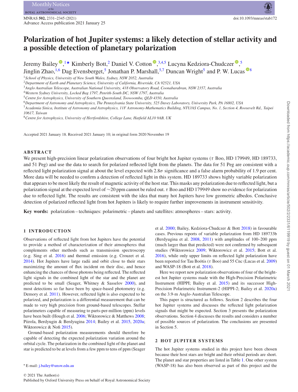 Polarization of Hot Jupiter Systems: a Likely Detection of Stellar Activity and a Possible Detection of Planetary Polarization