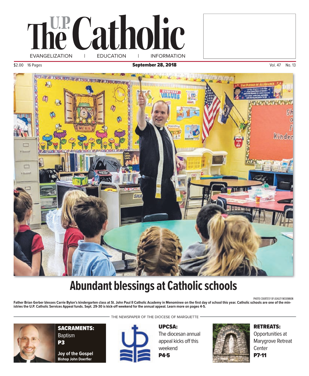 Abundant Blessings at Catholic Schools PHOTO COURTESY of ASHLEY MCKINNON Father Brian Gerber Blesses Carrie Bylon’S Kindergarten Class at St