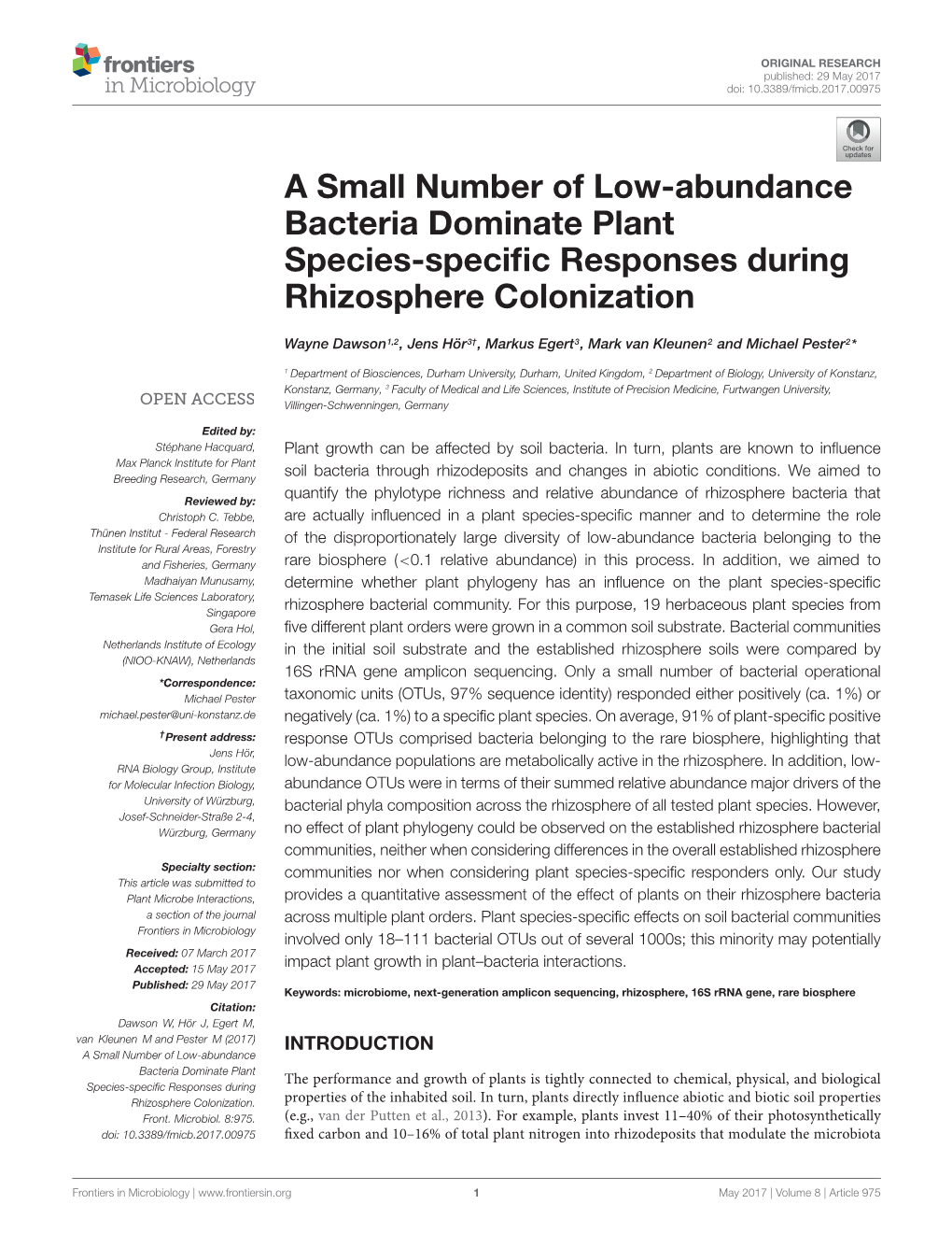 A Small Number of Low-Abundance Bacteria Dominate Plant Species-Specific Responses During Rhizosphere Colonization