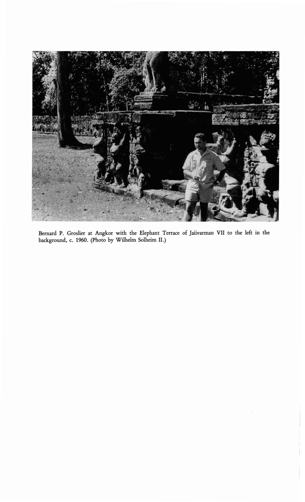 Bernard P. Groslier at Angkor with the Elephant Terrace of Jaiivarman VII to the Left in the Background, C