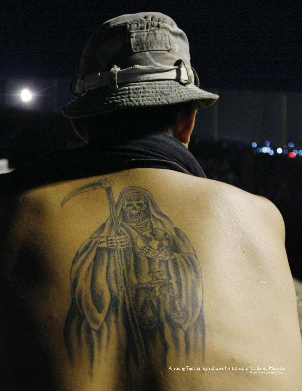 A Young Tijuana Man Shows His Tattoo of La Santa Muerte. Photo from Associated Press