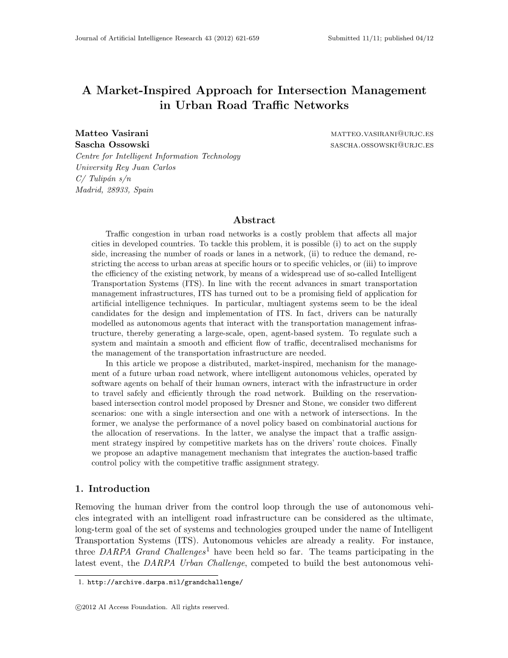 A Market-Inspired Approach for Intersection Management in Urban Road Traffic Networks