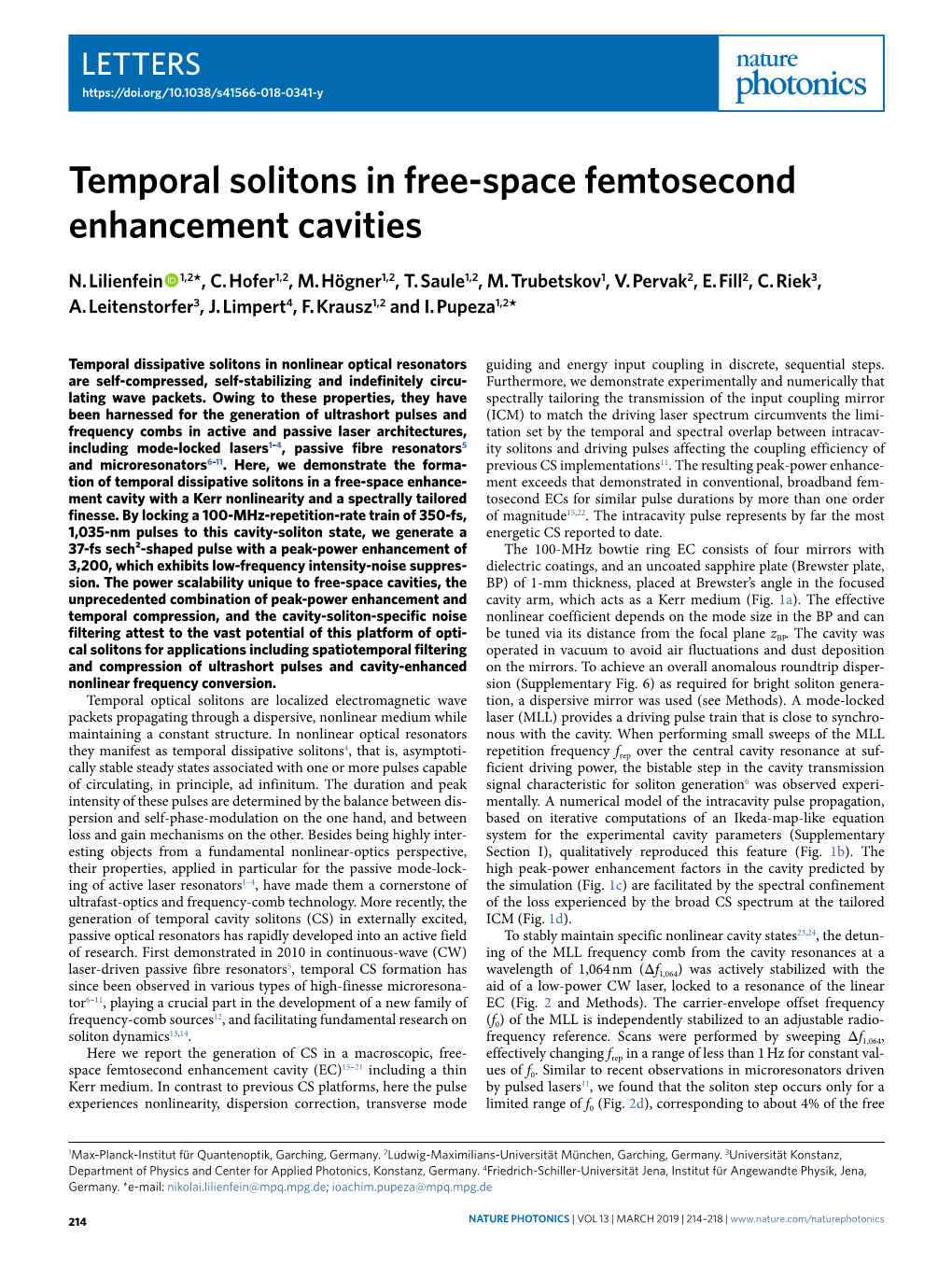 Temporal Solitons in Free-Space Femtosecond Enhancement Cavities